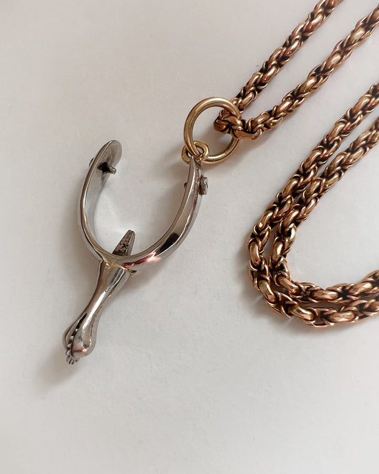 ANTIQUE PLATINUM SPUR PENDANT