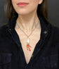19TH CENTURY CORAL HAND WITH AMULETS