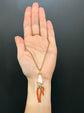 19TH CENTURY CORAL HAND WITH AMULETS