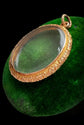 VICTORIAN ORNATE GOLD FRAMED GLASS LOCKET