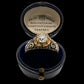 19TH CENTURY DIAMOND RING WITH BLACK ENAMEL SCROLL BAND