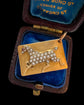 ANTIQUE PEARL & 15CT GOLD HORSE TOKEN PENDANT