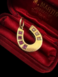 VICTORIAN RUBY & DIAMOND 15CT GOLD HORSESHOE PENDANT