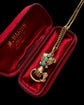 GEORGIAN HIGH CARAT GOLD HAND WITH SNAKE PENDANT