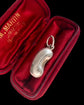 ANTIQUE SILVER & ENAMEL LUCKY BEAN PENDANT