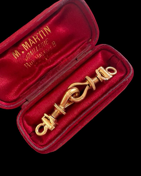 A PAIR OF ANTIQUE CHUNKY 18CT GOLD TWIST DOG CLIPS