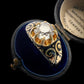 19TH CENTURY DIAMOND RING WITH BLACK ENAMEL SCROLL BAND