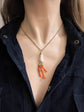 19TH CENTURY CORAL HAND WITH AMULETS