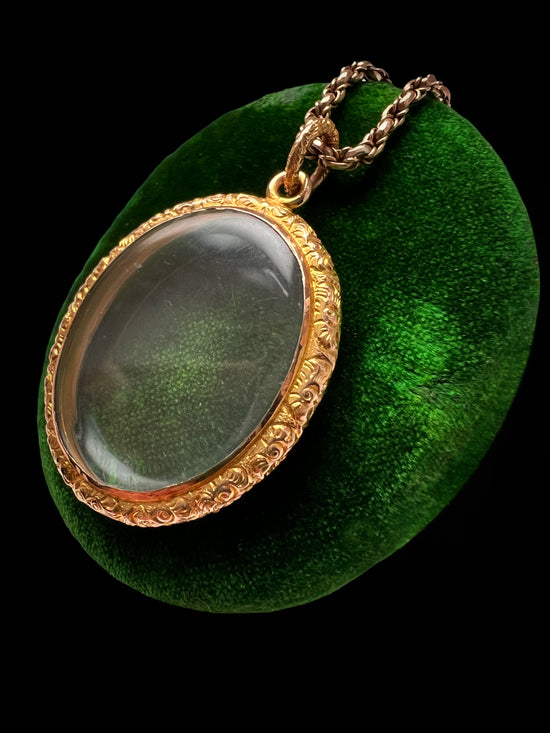 VICTORIAN ORNATE GOLD FRAMED GLASS LOCKET