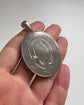 LARGE SCALE VICTORIAN SILVER ‘GARTER MOTIF’ LOCKET
