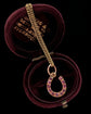 ANTIQUE NATURAL RUBY & 18CT GOLD HORSESHOE PENDANT