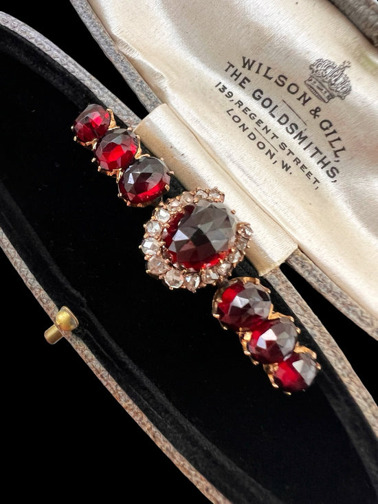 VICTORIAN DIAMOND HORSESHOE AND GARNET BROOCH