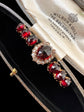 VICTORIAN DIAMOND HORSESHOE AND GARNET BROOCH