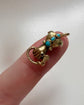 GEORGIAN HIGH CARAT GOLD HAND WITH SNAKE PENDANT