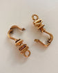 A PAIR OF ANTIQUE CHUNKY 18CT GOLD TWIST DOG CLIPS
