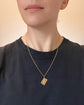 ANTIQUE PEARL & 15CT GOLD HORSE TOKEN PENDANT
