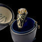 19TH CENTURY DIAMOND RING WITH BLACK ENAMEL SCROLL BAND