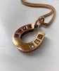 VICTORIAN RUBY & DIAMOND 15CT GOLD HORSESHOE PENDANT