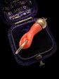 EARLY 19TH CENTURY CORAL HAND PENDANT