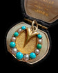 VICTORIAN 15CT GOLD & TURQUOISE HORSE HOOF PENDANT
