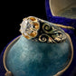 19TH CENTURY DIAMOND RING WITH BLACK ENAMEL SCROLL BAND