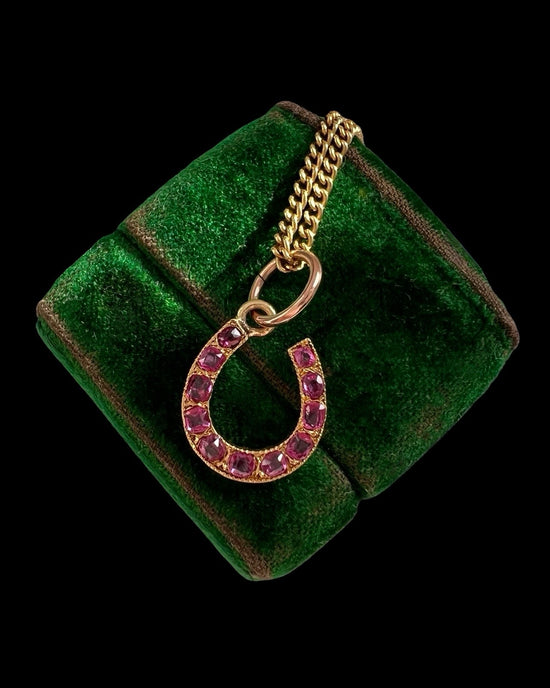 ANTIQUE NATURAL RUBY & 18CT GOLD HORSESHOE PENDANT