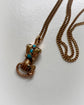GEORGIAN HIGH CARAT GOLD HAND WITH SNAKE PENDANT