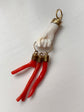 19TH CENTURY CORAL HAND WITH AMULETS