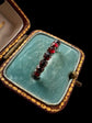 GEORGIAN FACETED GARNET ETERNITY RING