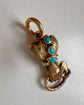 GEORGIAN HIGH CARAT GOLD HAND WITH SNAKE PENDANT