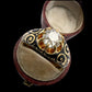 19TH CENTURY DIAMOND RING WITH BLACK ENAMEL SCROLL BAND