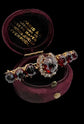 VICTORIAN DIAMOND HORSESHOE AND GARNET BROOCH
