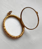 VICTORIAN ORNATE GOLD FRAMED GLASS LOCKET