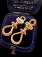A PAIR OF ANTIQUE CHUNKY 18CT GOLD TWIST DOG CLIPS