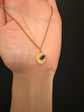 18CT GOLD DISC PENDANT WITH ENAMEL URN