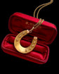 VICTORIAN 15CT GOLD HORSESHOE PENDANT ‘SLOW RACE’