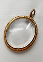 VICTORIAN ORNATE GOLD FRAMED GLASS LOCKET