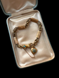 GEORGIAN 15CT GOLD BRACELET WITH A GEM SET HAND, SNAKE & HEART CLASP
