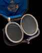 LARGE SCALE VICTORIAN SILVER ‘GARTER MOTIF’ LOCKET