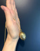 ANTIQUE SILVER GILDED EGG PENDANT