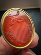 GEORGIAN HIGH CARAT GOLD FOB PENDANT WITH DOG INTAGLIO