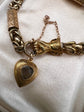 GEORGIAN 15CT GOLD BRACELET WITH A GEM SET HAND, SNAKE & HEART CLASP
