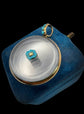 VICTORIAN GLASS LOCKET WITH PANSY FLOWER CENTRE & TURQUOISE BAIL