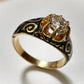 19TH CENTURY DIAMOND RING WITH BLACK ENAMEL SCROLL BAND