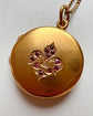 ANTIQUE 15CT GOLD & RUBY MULTI ‘FAMILY’ DISC LOCKET