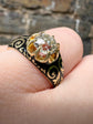 19TH CENTURY DIAMOND RING WITH BLACK ENAMEL SCROLL BAND