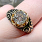 19TH CENTURY DIAMOND RING WITH BLACK ENAMEL SCROLL BAND