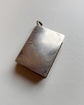 EARLY 20TH CENTURY SILVER BOOK LOCKET PENDANT