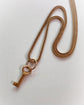 ANTIQUE MINIATURE GOLD KEY PENDANT