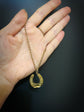 VICTORIAN DIAMOND & RUBY 15CT GOLD HORSESHOE PENDANT ‘SANS ADIEU’